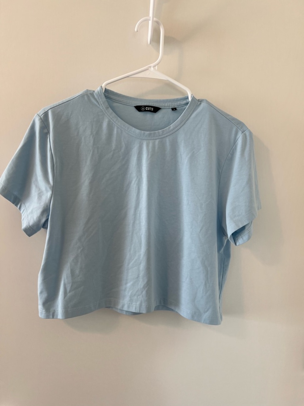 Cuts clothing almost Friday tee